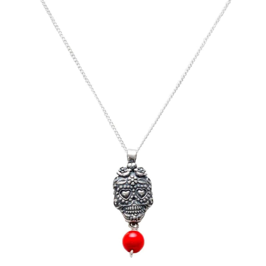 Dije calavera ojos corazón coral