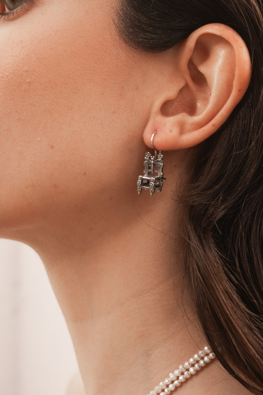 Aretes Muñeca Sentada