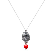 Dije calavera ojos corazón coral